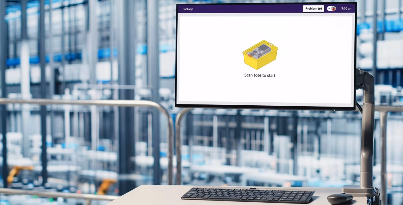 Amazon PackApp hero — associate at packing station